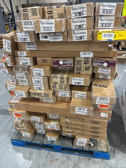Pallet of assorted faux wood… — Photo 1