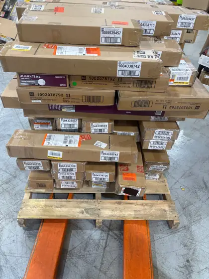 Pallet of assorted faux wood… — Photo 1