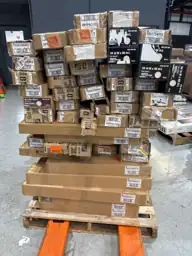 Pallet of assorted faux wood… — Photo 1