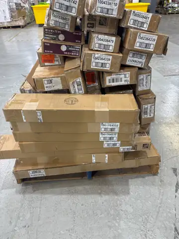 Pallet of assorted faux wood… — Photo 1