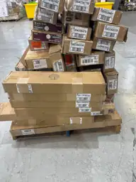 Pallet of assorted faux wood… — Photo 1